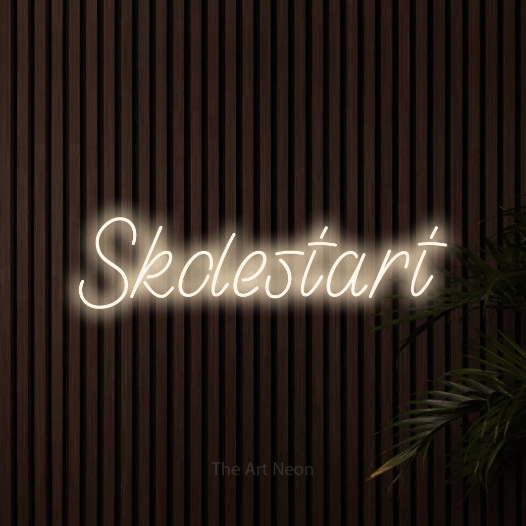 LED neon sign reading “Skolestart”, arranged in a single line.