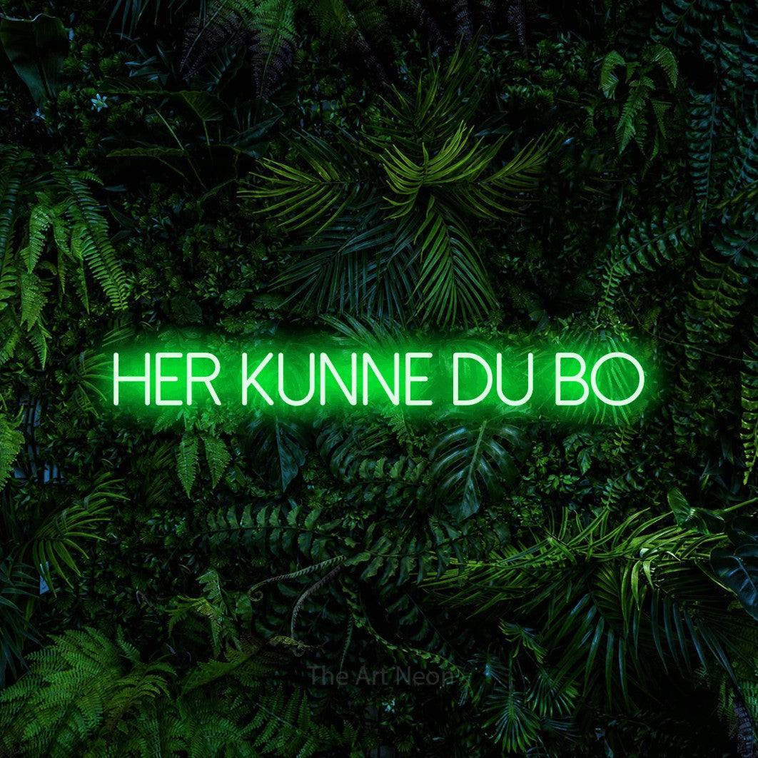 LED neon sign reading “her kunne du bo”, arranged in a single line.
