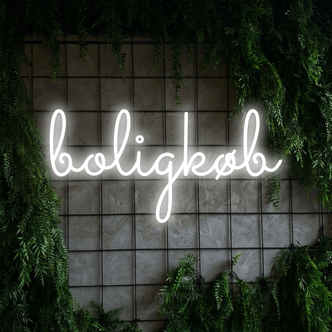 LED neon sign reading “boligkøb”, arranged in a single line.