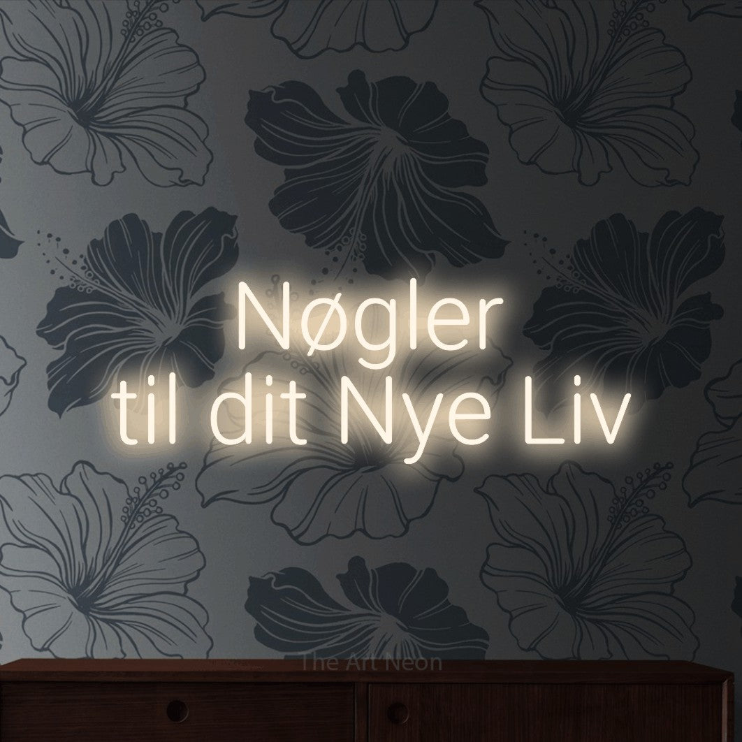 LED neon sign reading “Nøgler til dit Nye Liv”, arranged in 2 lines.