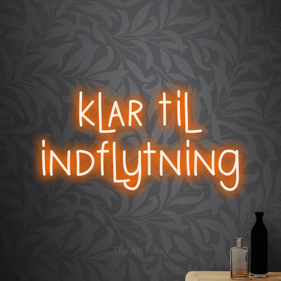 LED neon sign reading “klar til indflytning”, arranged in 2 lines.