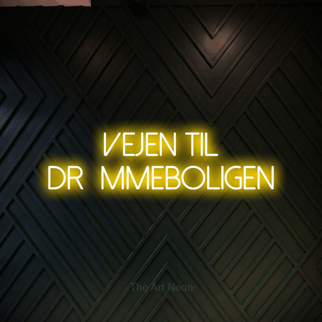 LED neon sign reading “Vejen til drømmeboligen”, arranged in 2 lines.