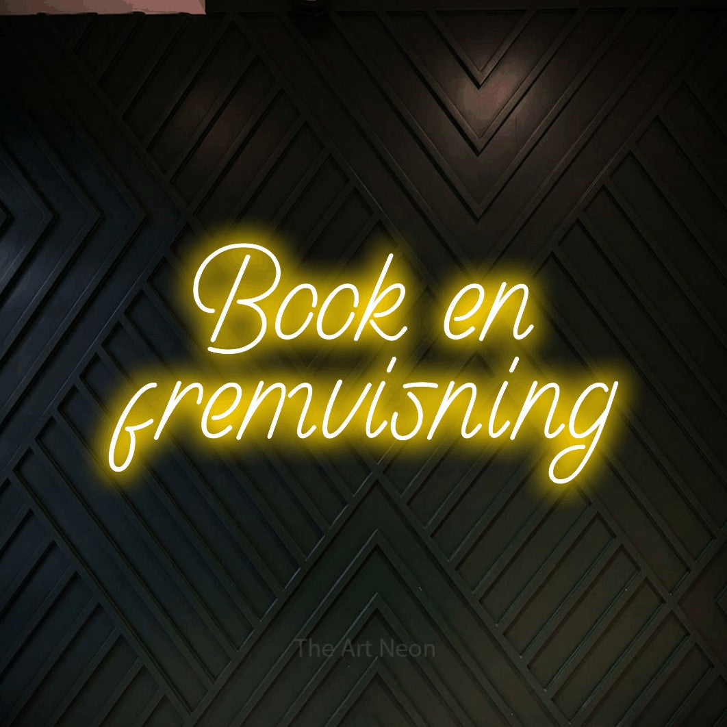 LED neon sign reading “Book en fremvisning”, arranged in 2 lines.
