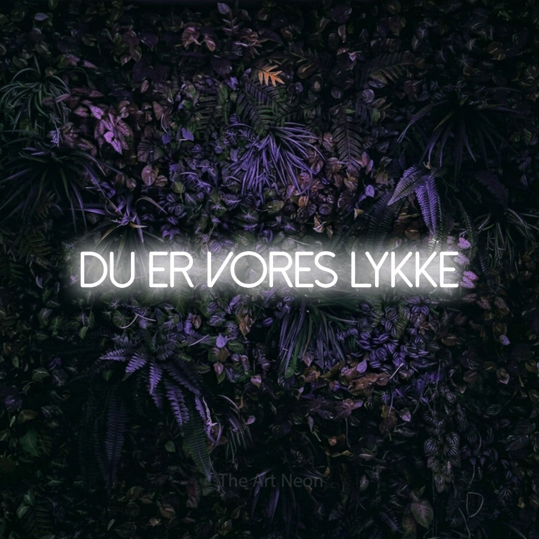 LED neon sign reading “Du er vores Lykke”, arranged in a single line.