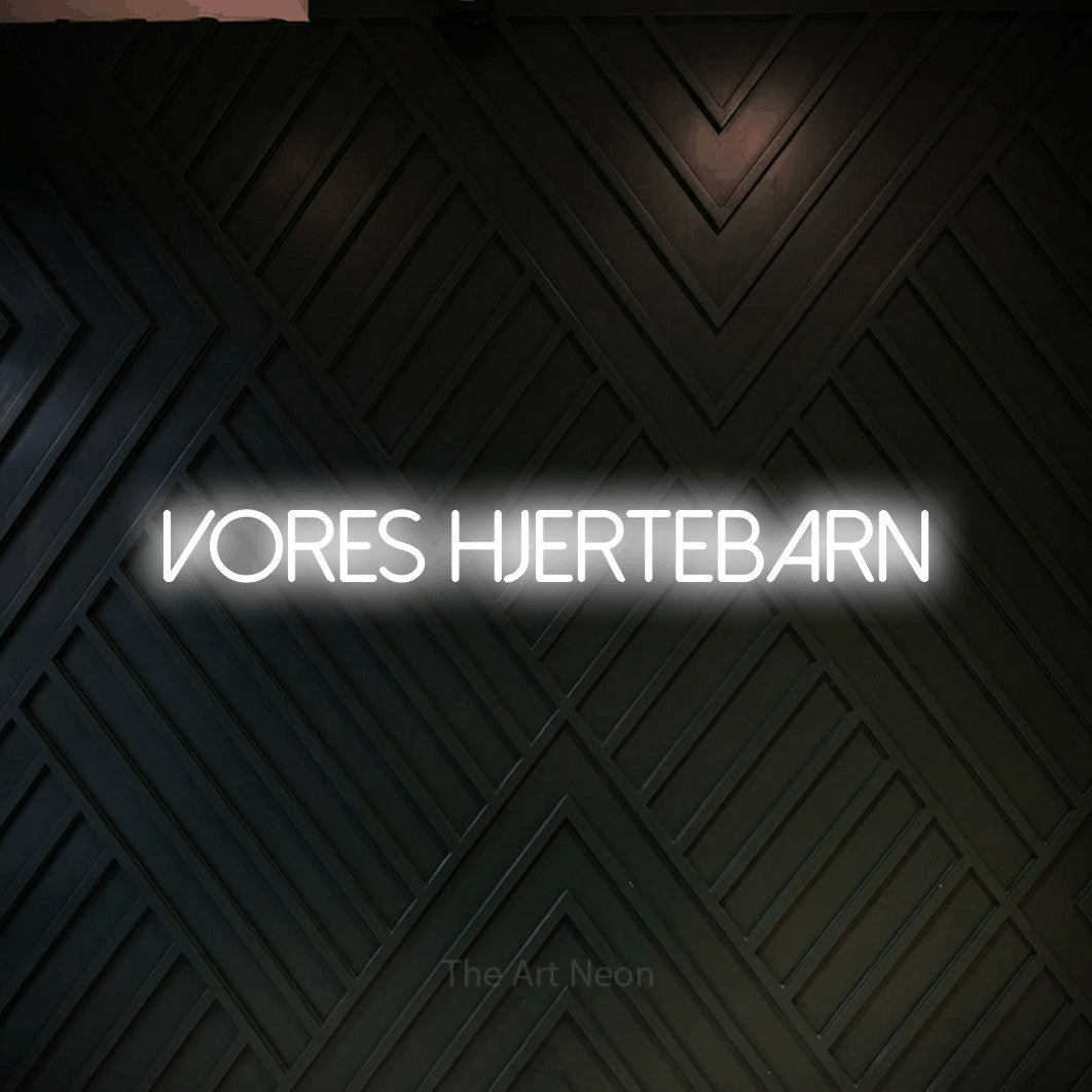 LED neon sign reading “VORES HJERTEBARN”, arranged in a single line.