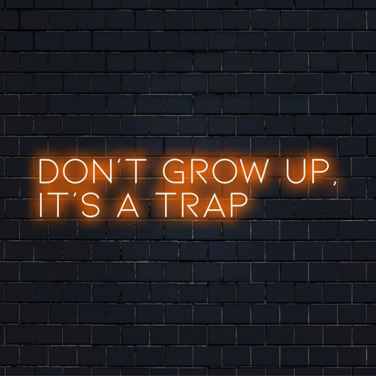 Custom made LED neon sign reading Don't Grow Up It's A Trap—an eye-catching neon message for any space.