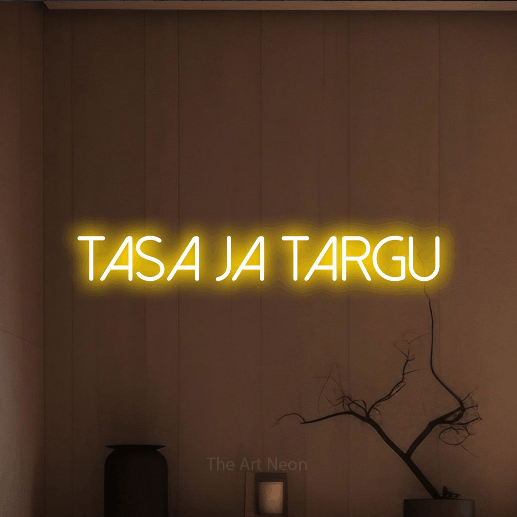 LED neon sign reading “tasa ja targu”, arranged in a single line.