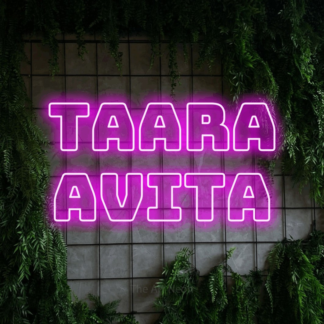 LED neon sign reading “TAARA AVITA”, arranged in 2 lines.