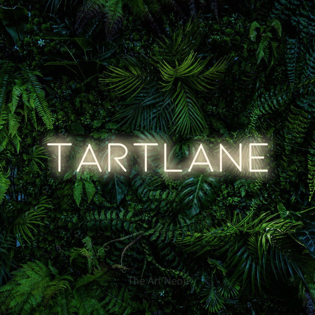 LED neon sign reading “Tartlane”, arranged in a single line.