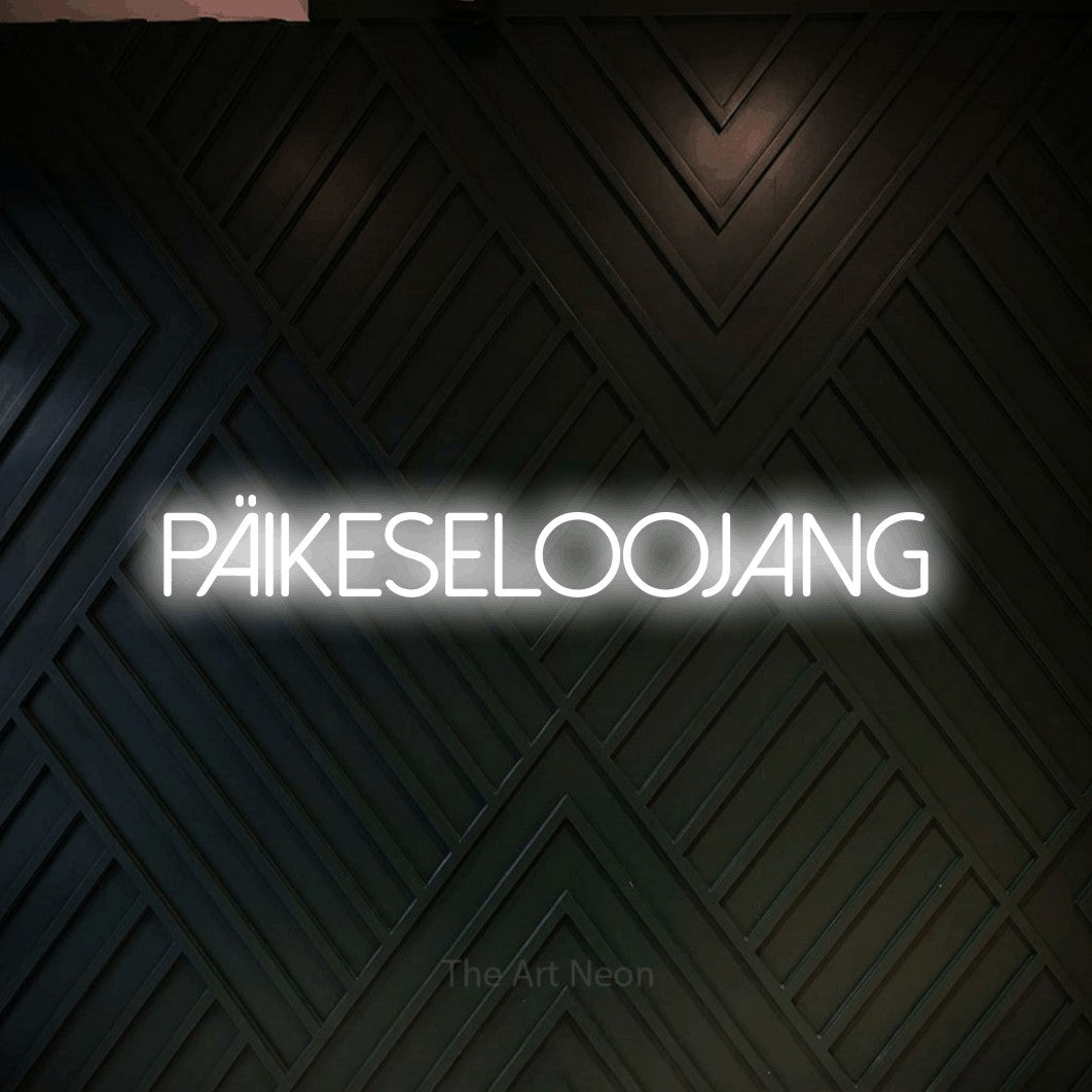 LED neon sign reading “päikeseloojang”, arranged in a single line.