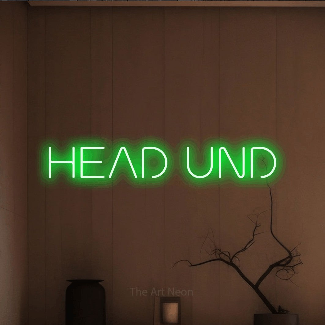 LED neon sign reading “HEAD UND”, arranged in a single line.