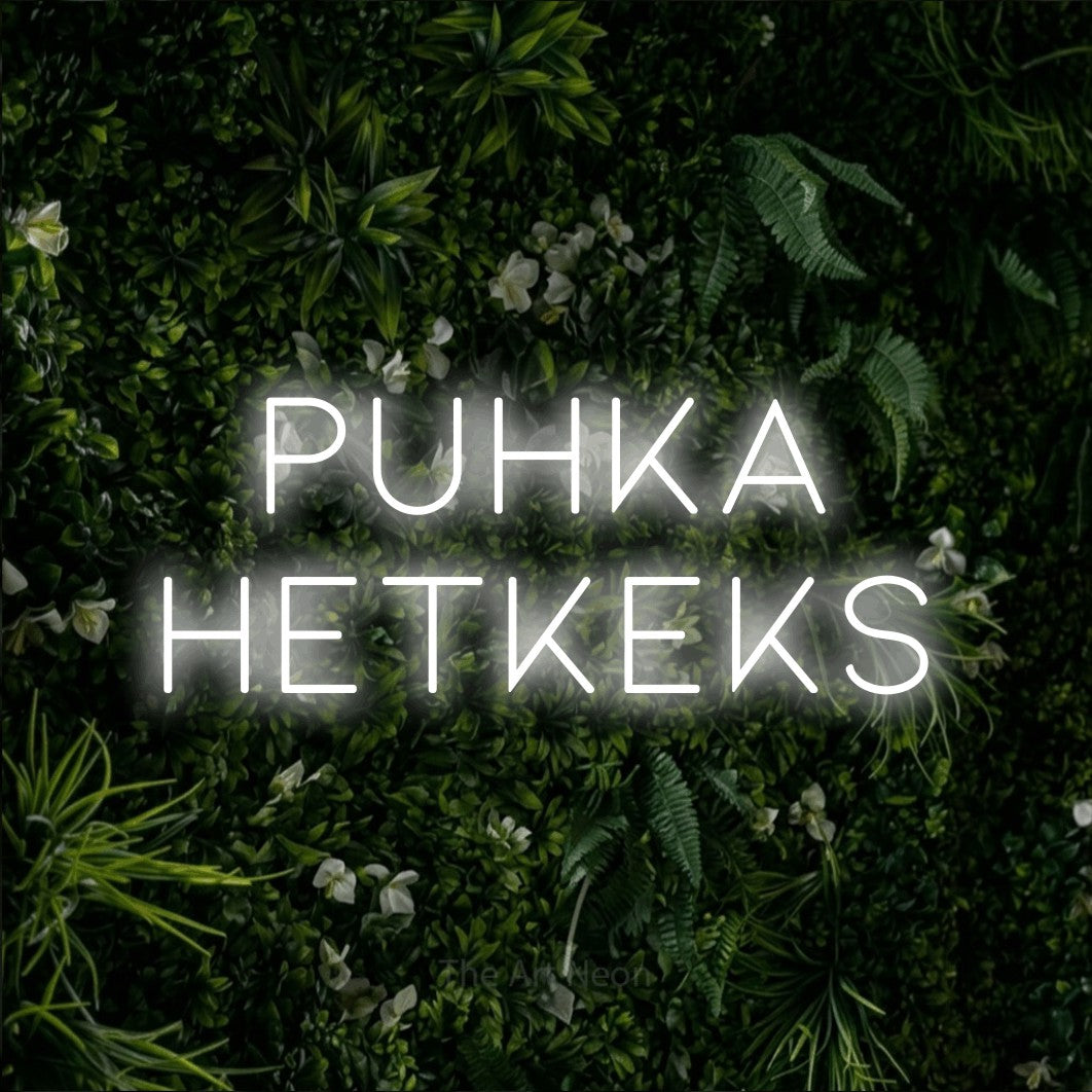 LED neon sign reading “PUHKA HETKEKS”, arranged in 2 lines.
