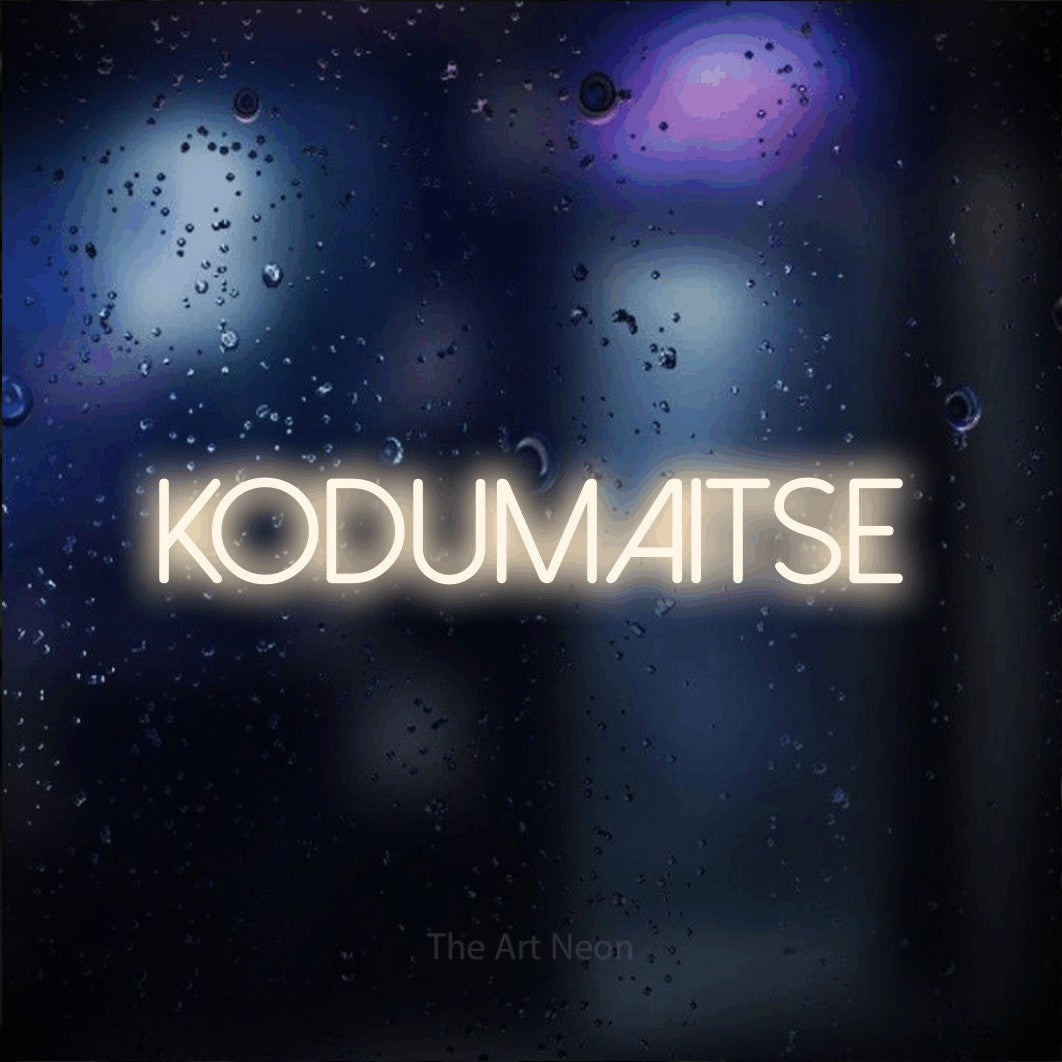 LED neon sign reading “KODUMAITSE”, arranged in a single line.