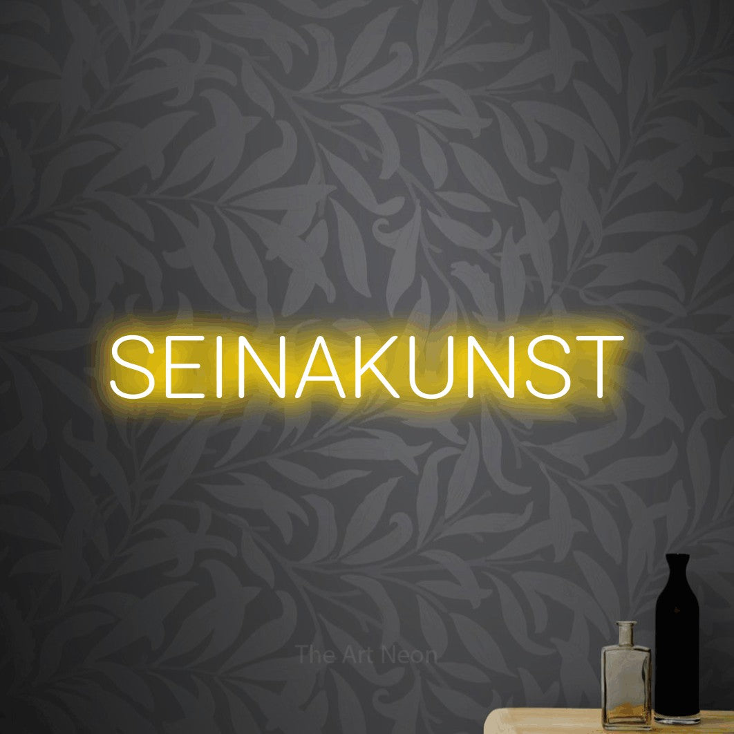 LED neon sign reading “SEINAKUNST”, arranged in a single line.
