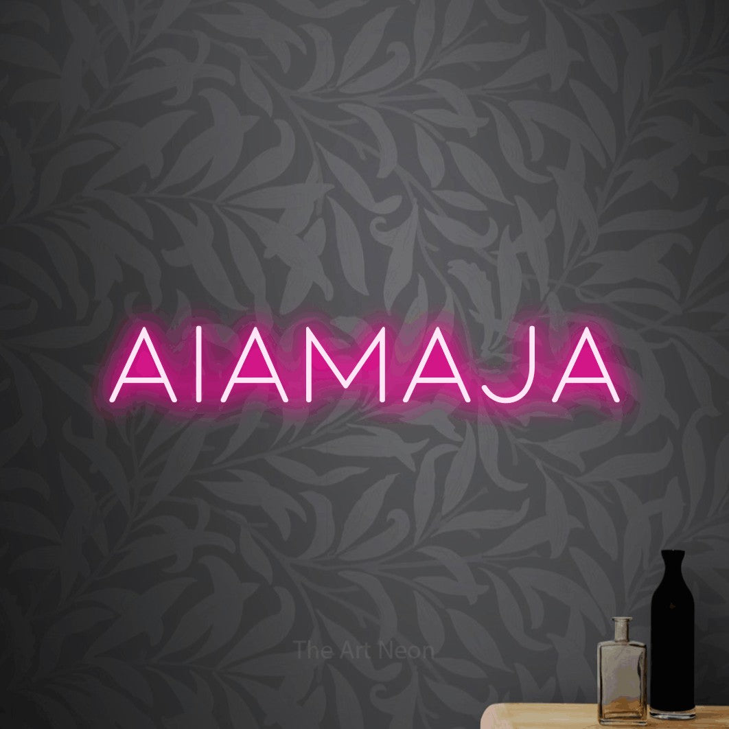 LED neon sign reading “AIAMAJA”, arranged in a single line.