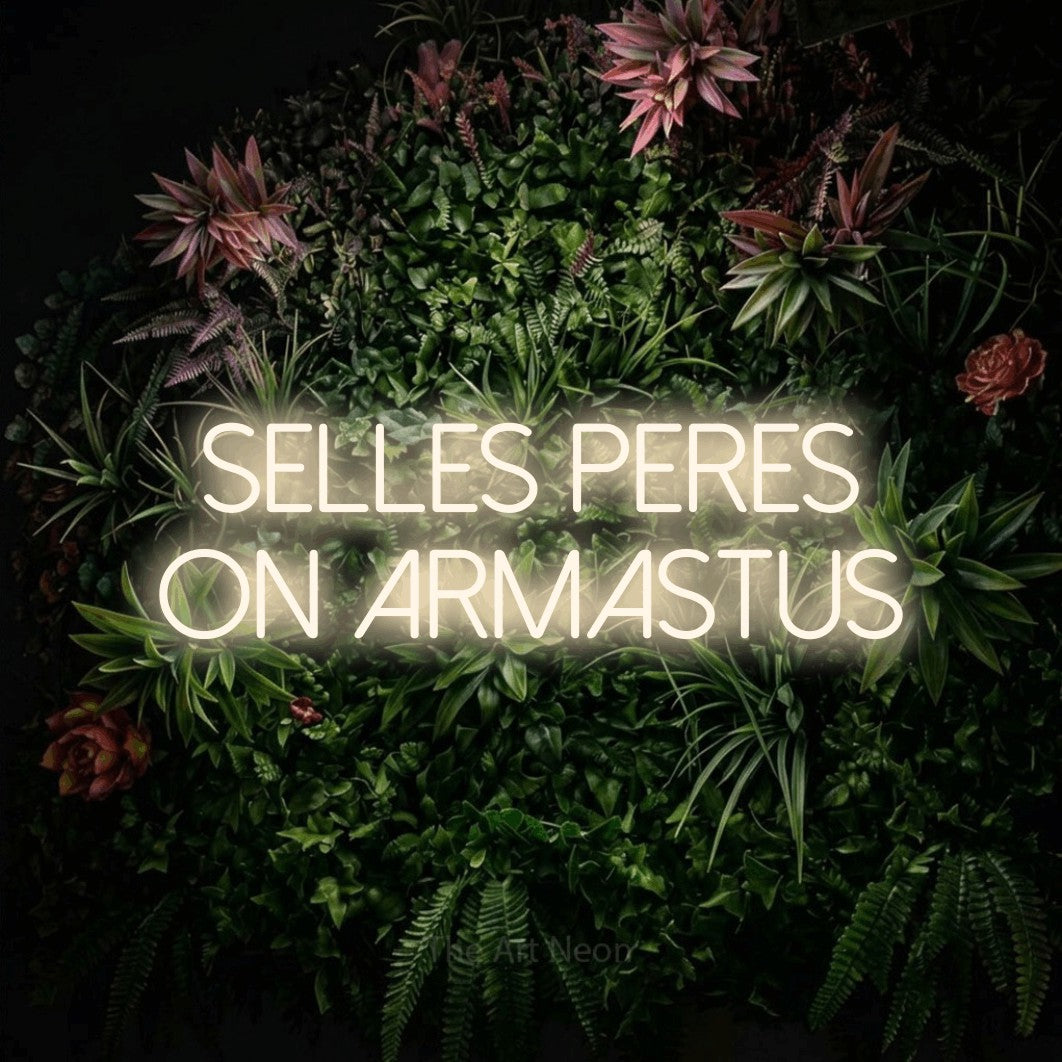 LED neon sign reading “SELLES PERES ON ARMASTUS”, arranged in 2 lines.