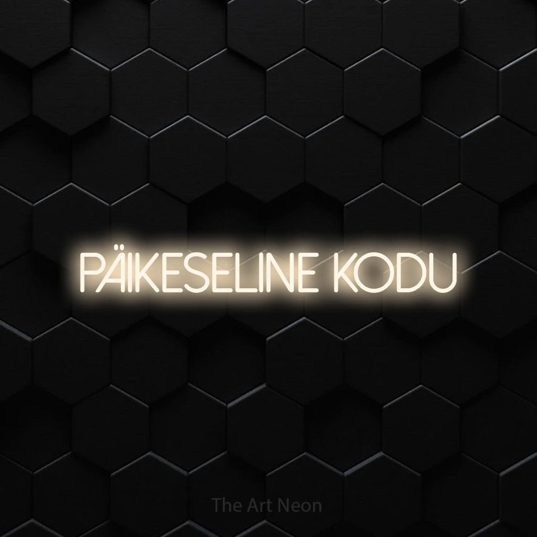 LED neon sign reading “päikeseline kodu”, arranged in a single line.