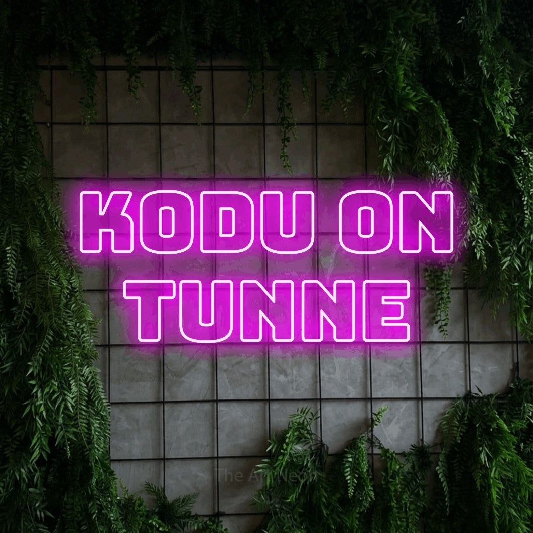LED neon sign reading “KODU On TUNNE”, arranged in 2 lines.