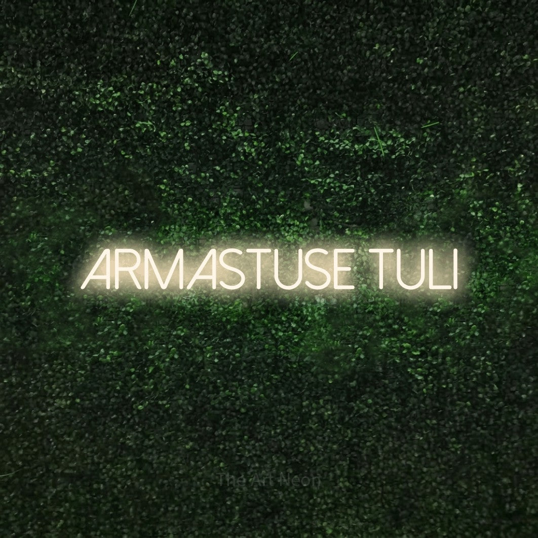 LED neon sign reading “ARMASTUSE TULI”, arranged in a single line.