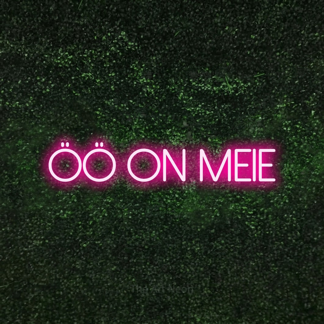 LED neon sign reading “ÖÖ On MEIE”, arranged in a single line.