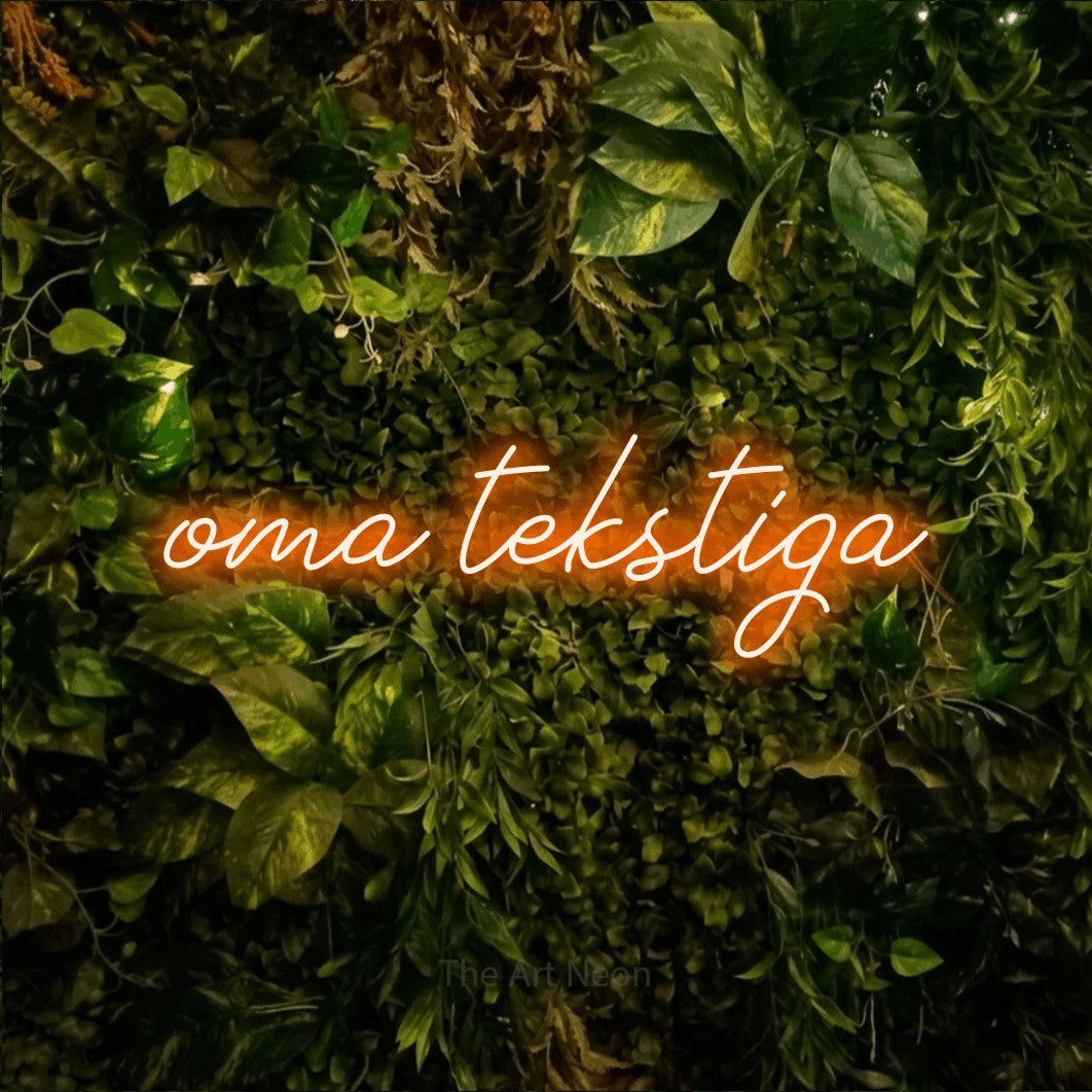 LED neon sign reading “oma tekstiga”, arranged in a single line.
