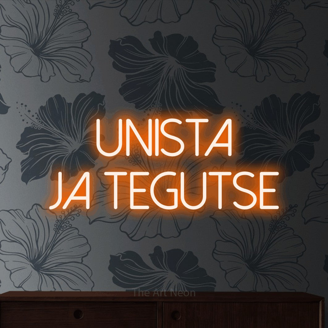 LED neon sign reading “unista ja tegutse”, arranged in 2 lines.