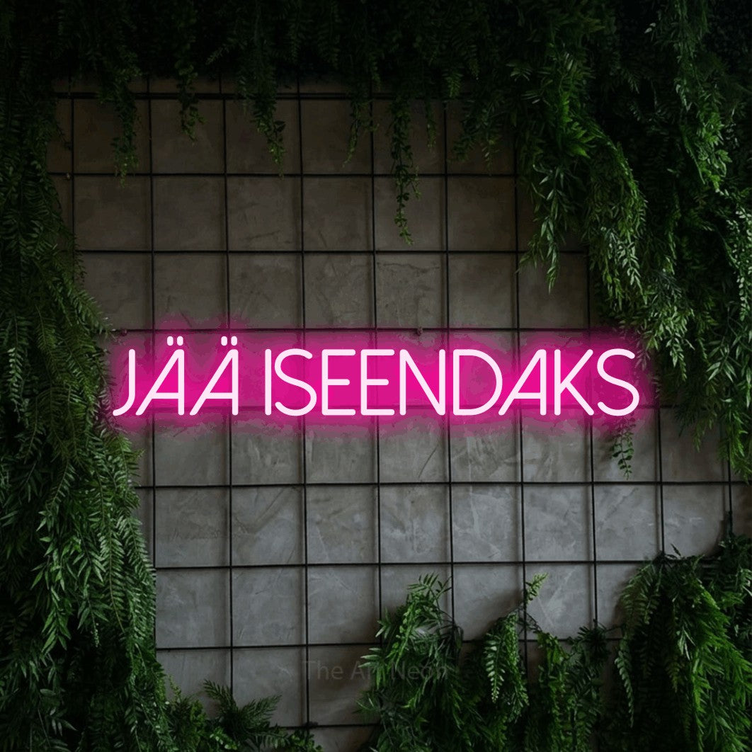 LED neon sign reading “JÄÄ ISEENDAKS”, arranged in a single line.