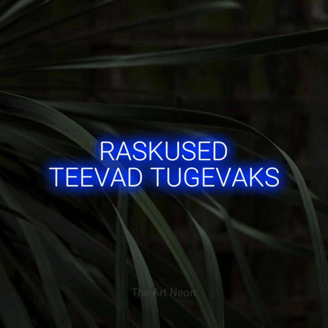 LED neon sign reading “RASKUSED TEEVAD TUGEVAKS”, arranged in 2 lines.