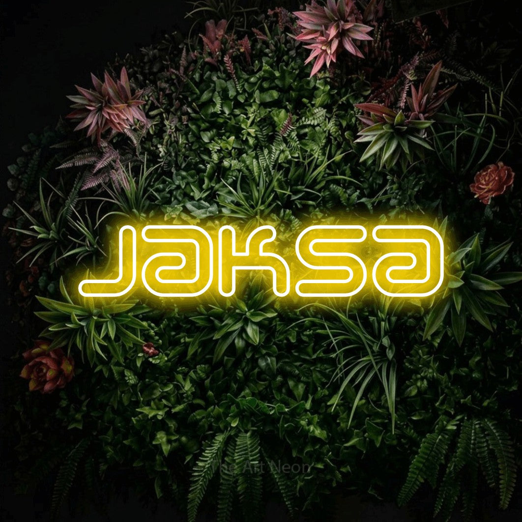 LED neon sign reading “Jaksa”, arranged in a single line.