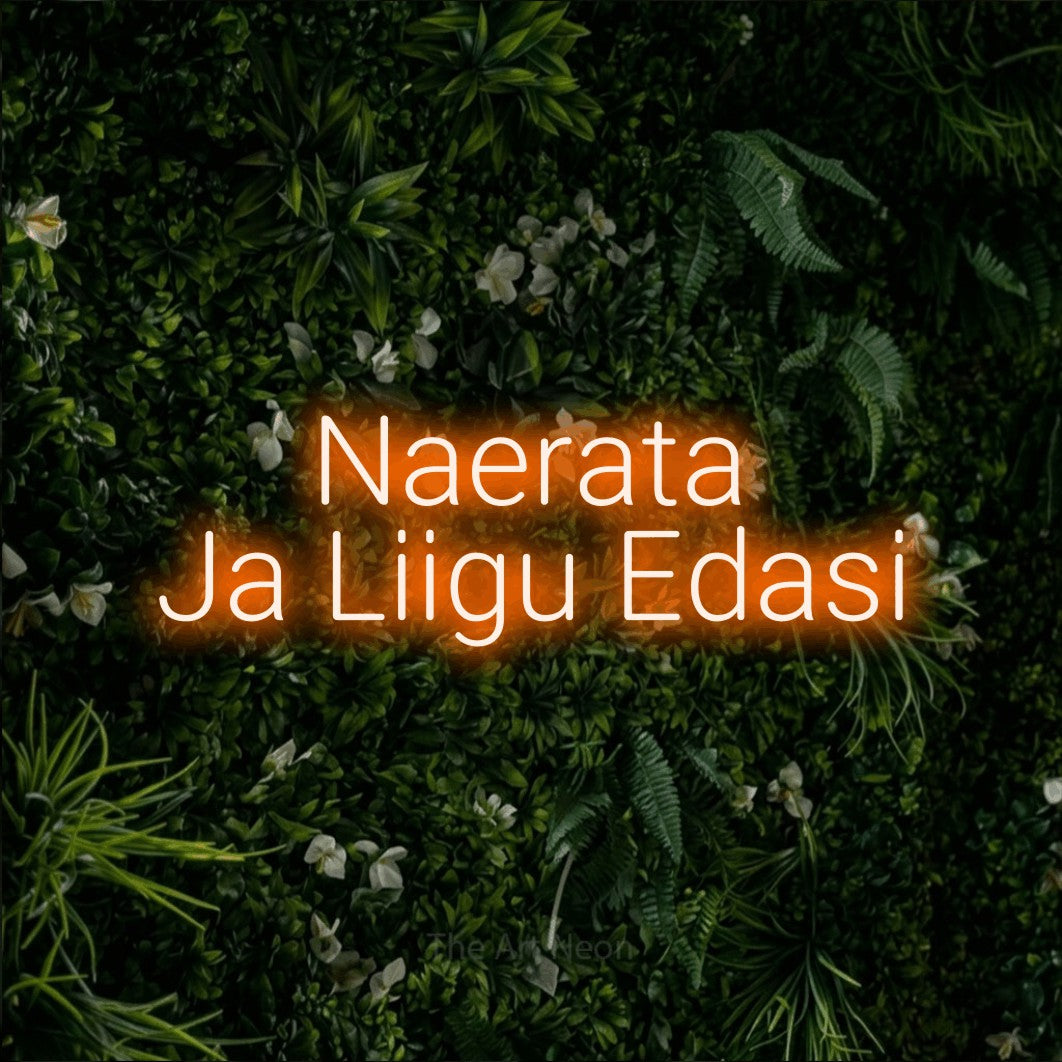 LED neon sign reading “Naerata Ja Liigu Edasi”, arranged in 2 lines.