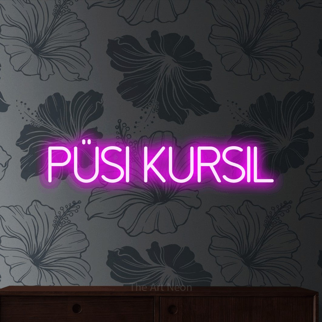 LED neon sign reading “püsi kursil”, arranged in a single line.