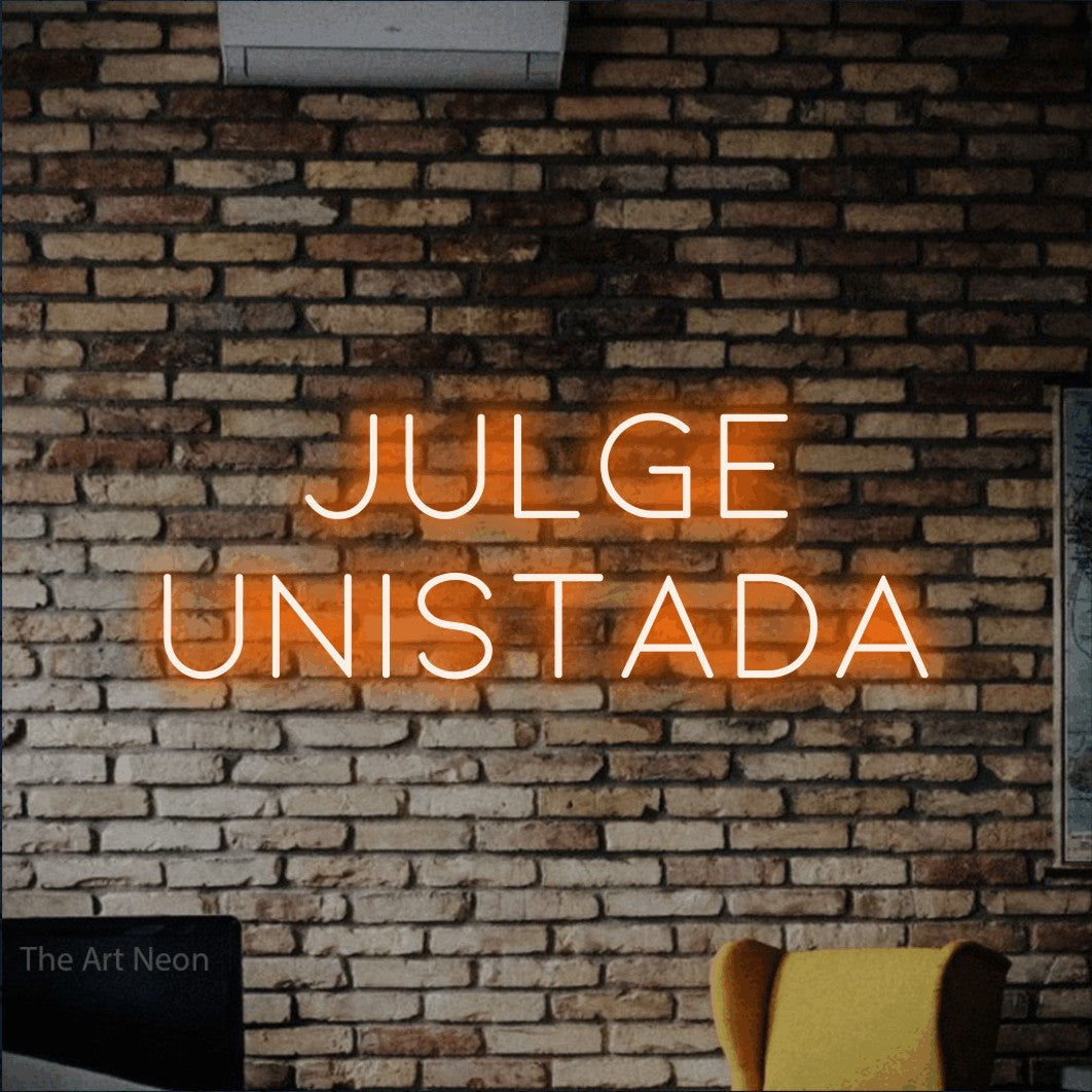 LED neon sign reading “JULGE UNISTADA”, arranged in 2 lines.