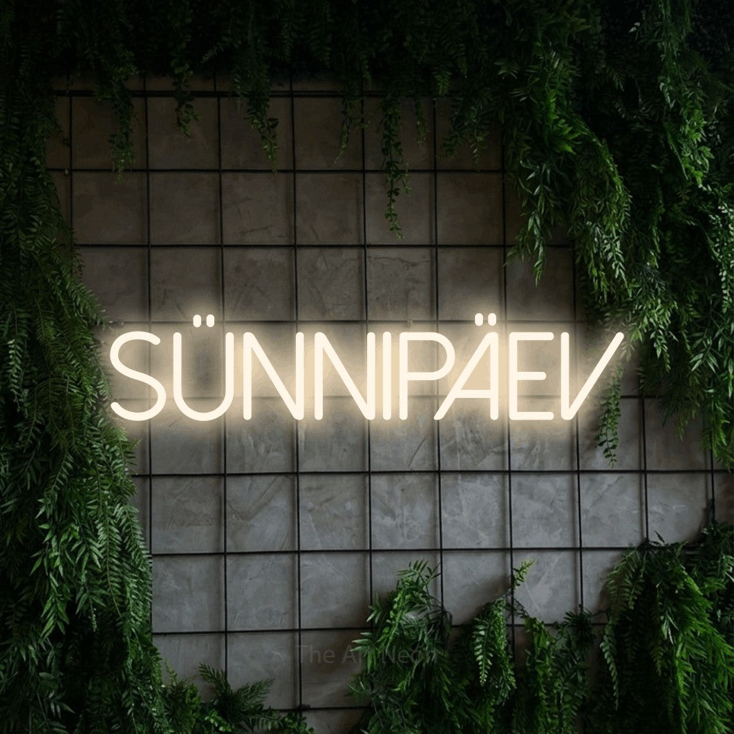 LED neon sign reading “sünnipäev”, arranged in a single line.