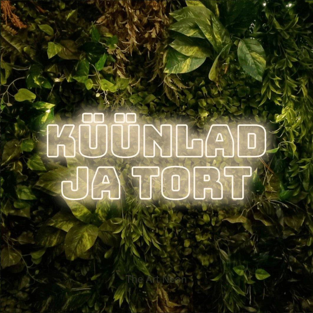 LED neon sign reading “KÜÜNLAD JA TORT”, arranged in 2 lines.