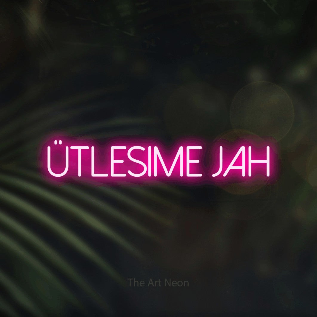 LED neon sign reading “ütlesime jah”, arranged in a single line.