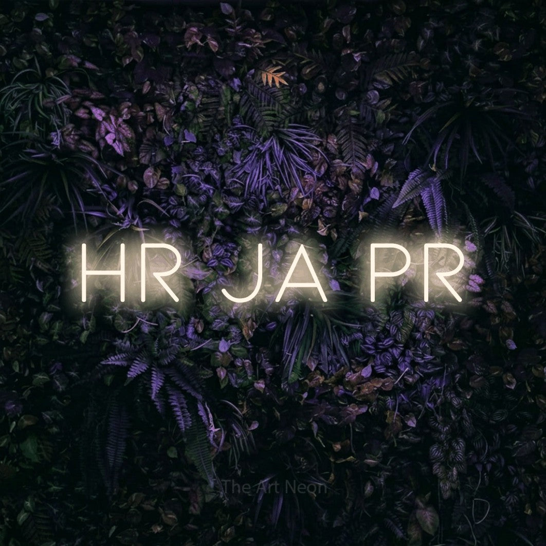 LED neon sign reading “Hr Ja Pr”, arranged in a single line.