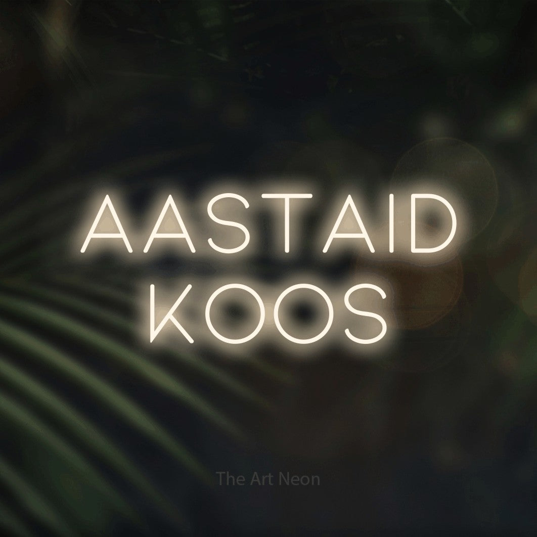 LED neon sign reading “AASTAID KOOS”, arranged in 2 lines.