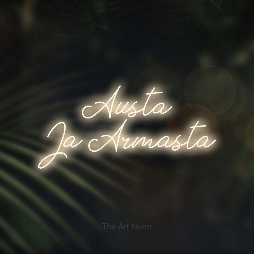 LED neon sign reading “Austa Ja Armasta”, arranged in 2 lines.