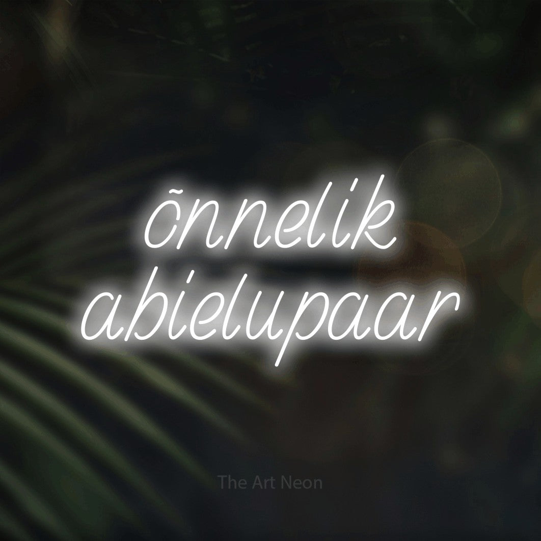 LED neon sign reading “õnnelik abielupaar”, arranged in 2 lines.