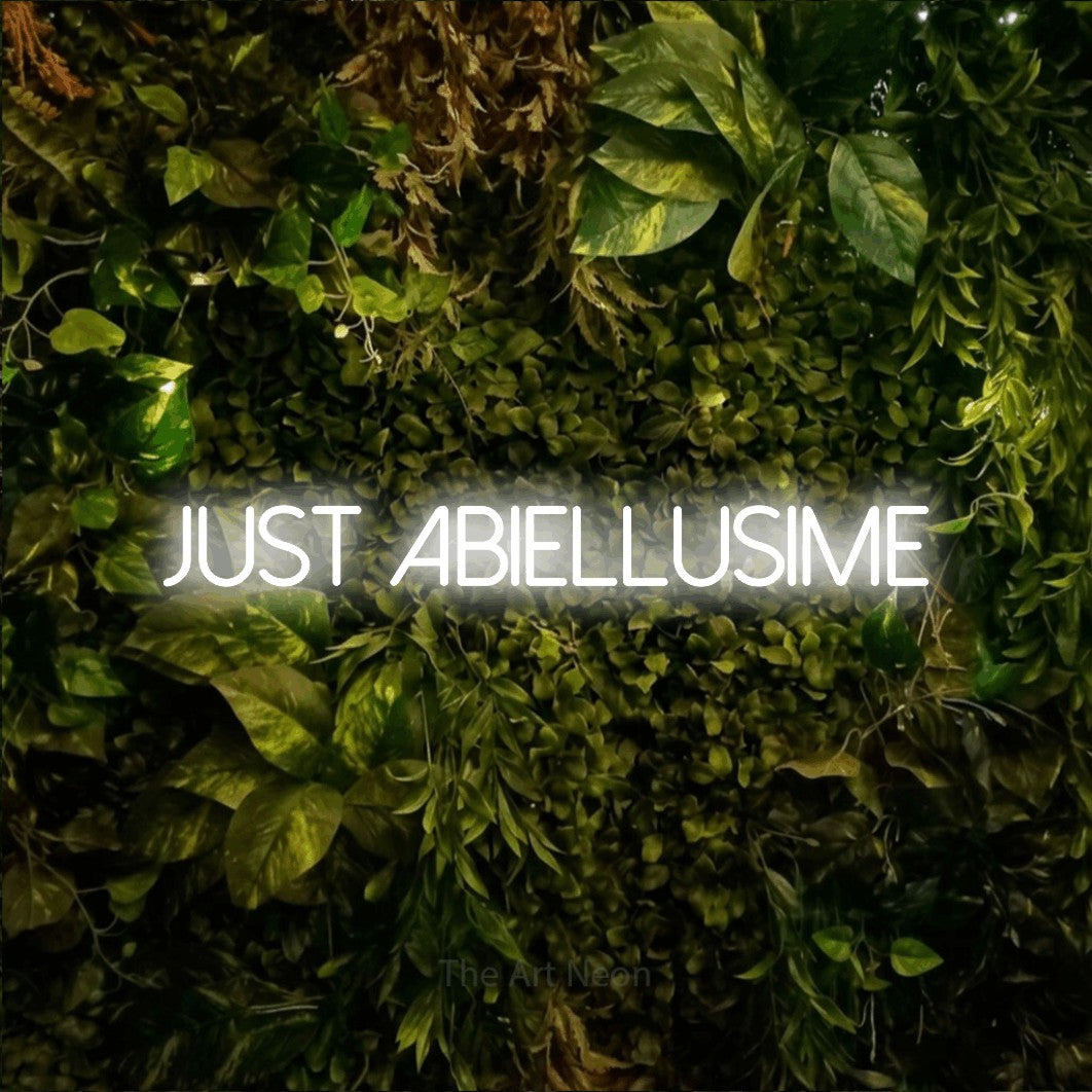 LED neon sign reading “Just Abiellusime”, arranged in a single line.