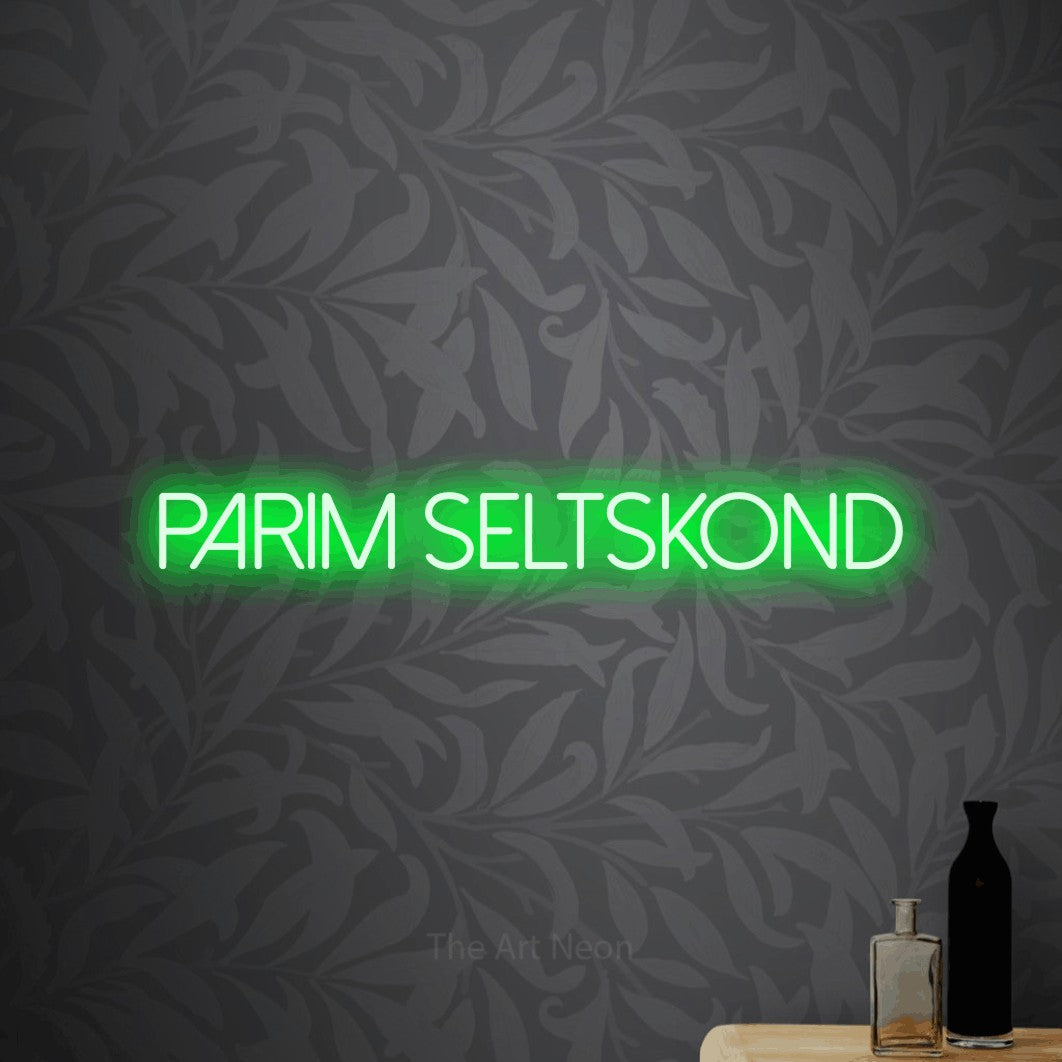 LED neon sign reading “parim seltskond”, arranged in a single line.