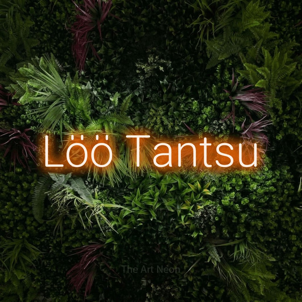 LED neon sign reading “Löö Tantsu”, arranged in a single line.