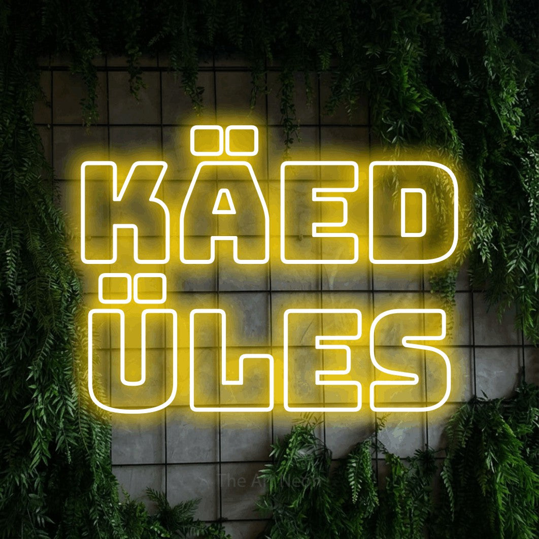 LED neon sign reading “Käed Üles”, arranged in 2 lines.