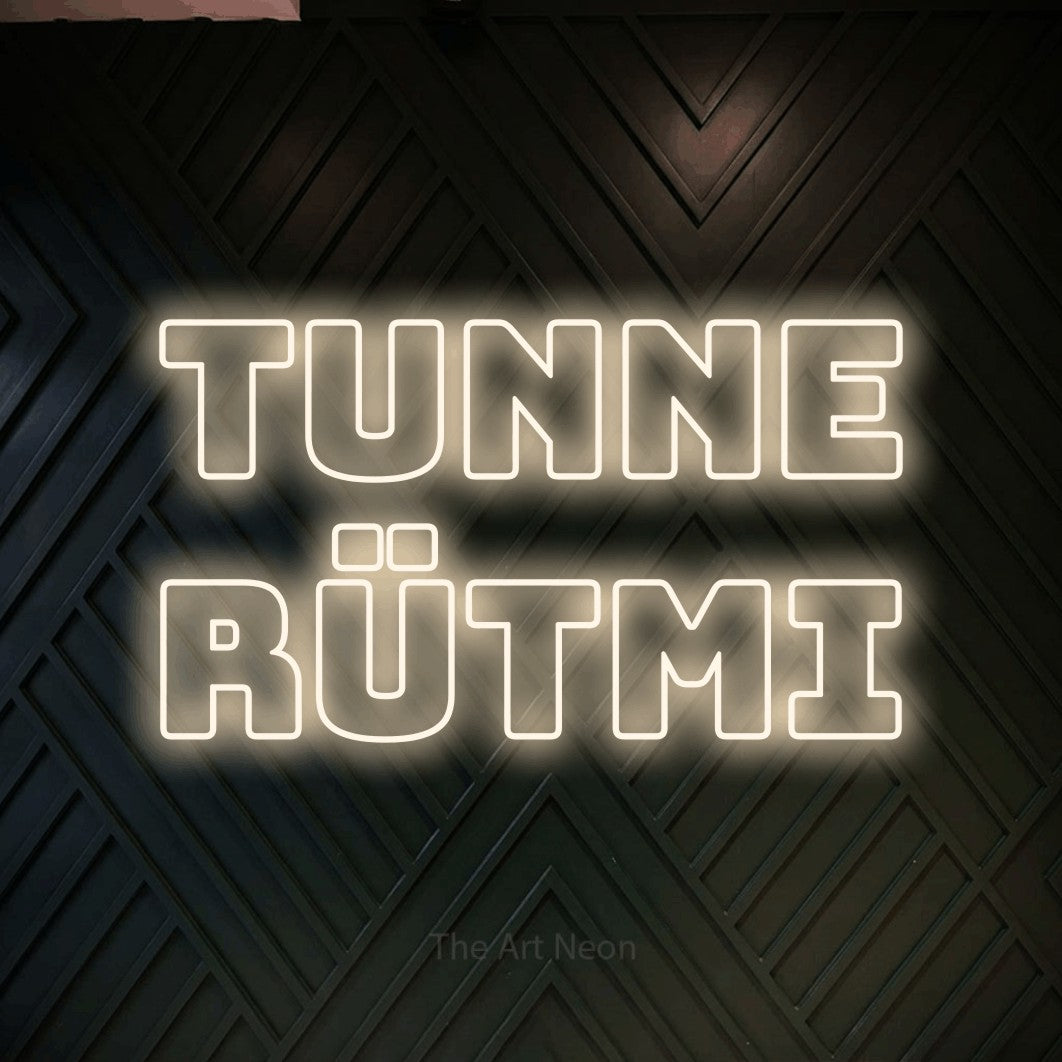 LED neon sign reading “TUNNE RÜTMI”, arranged in 2 lines.