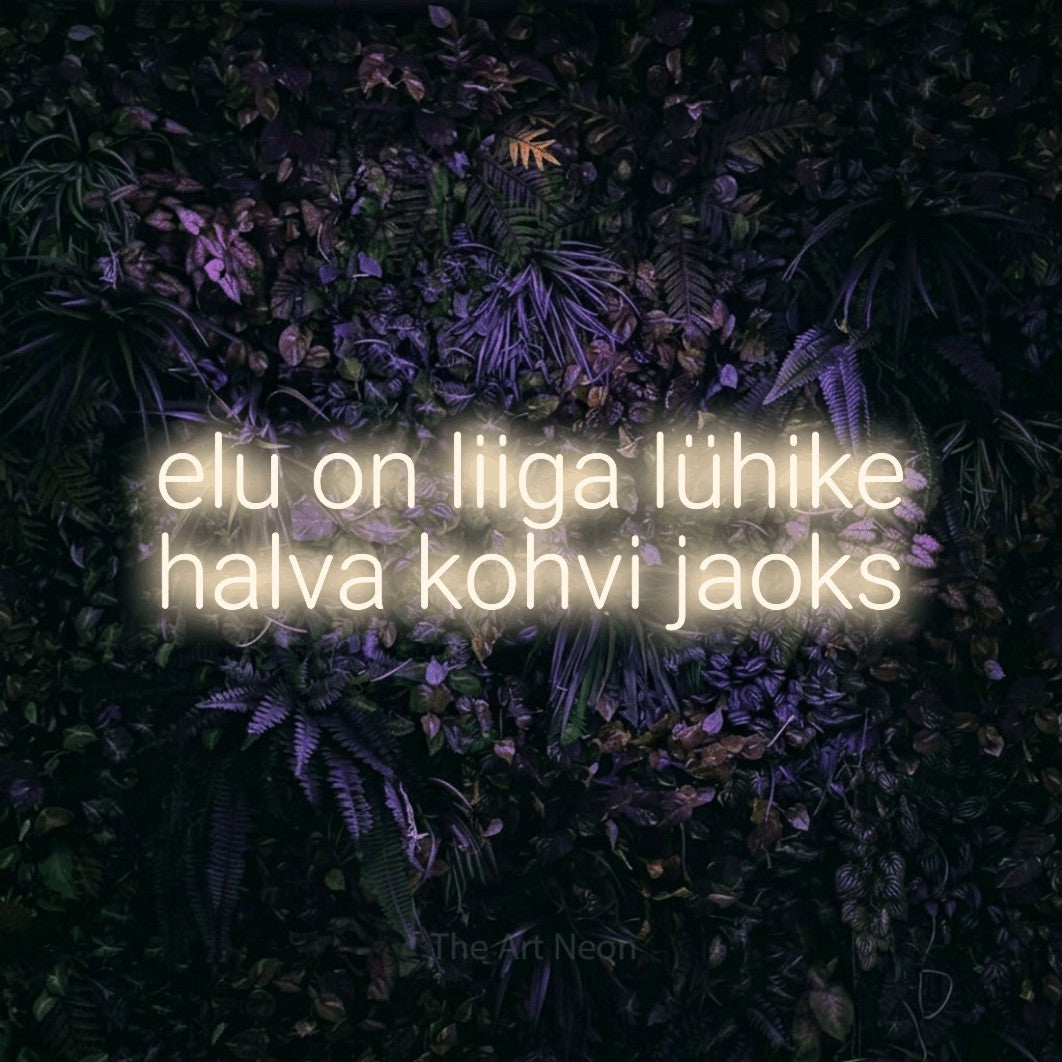 LED neon sign reading “elu on liiga lühike halva kohvi jaoks”, arranged in 2 lines.