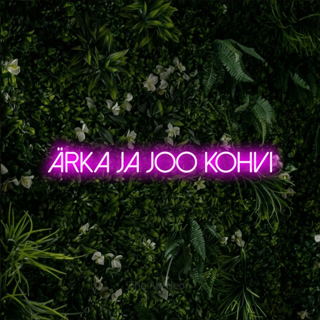 LED neon sign reading “ärka ja joo kohvi”, arranged in a single line.