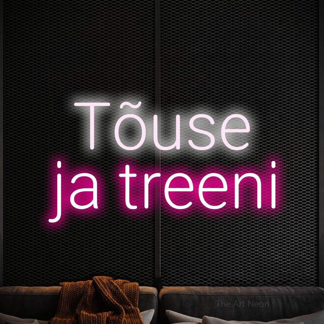 LED neon sign reading “Tõuse ja treeni”, arranged in 2 lines.