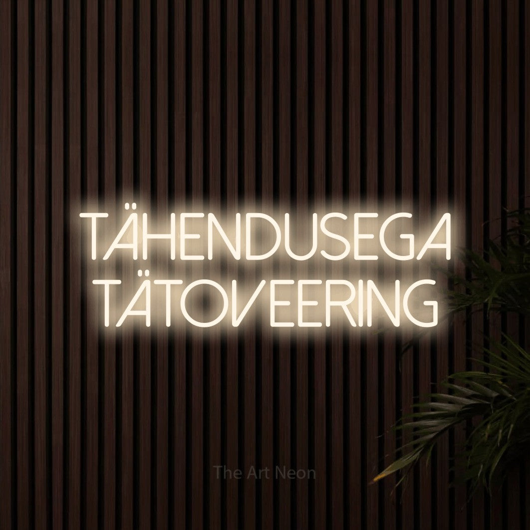 LED neon sign reading “Tähendusega tätoveering”, arranged in two lines.