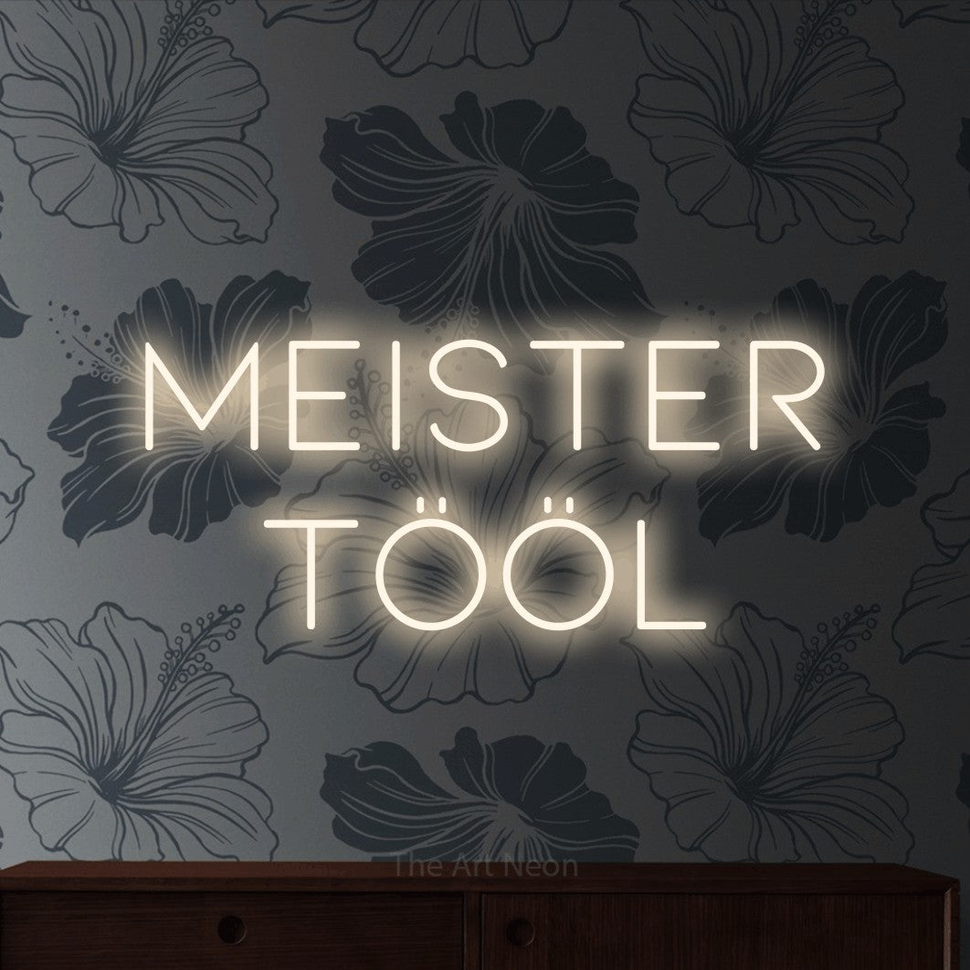 LED neon sign reading “MEISTER TÖÖL”, arranged in two lines.