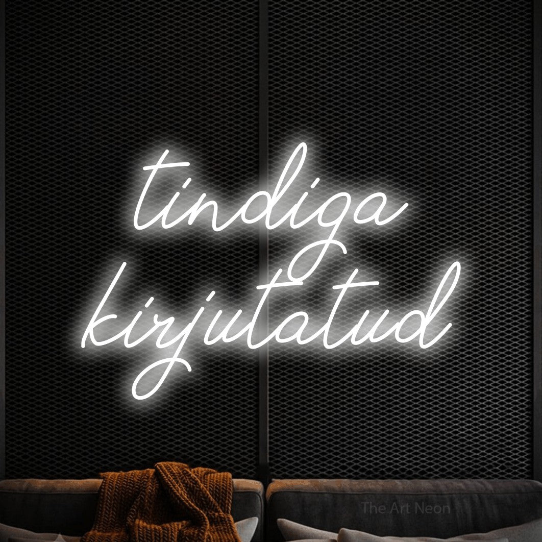 LED neon sign reading “tindiga kirjutatud”, arranged in two lines.